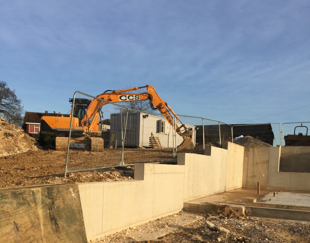 Structural concrete retaining walls and earth retention systems installed by CCS Contractors Ltd.